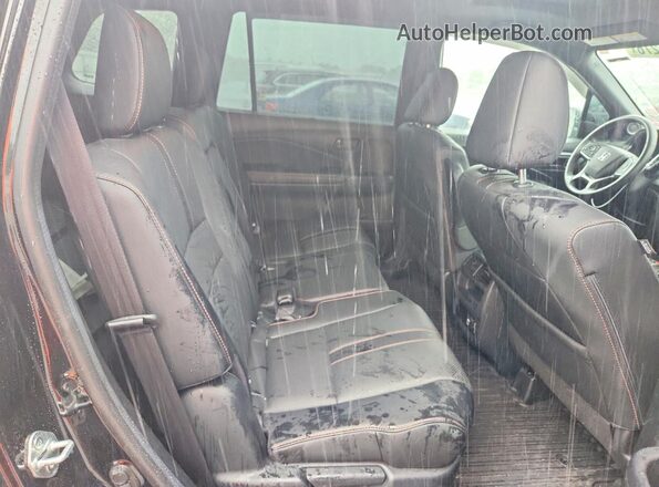 5FNYF8H62PB005236 2023 HONDA PASSPORT Black Vista interior trasera