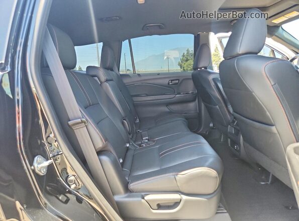 5FNYF8H66PB000170 2023 HONDA PASSPORT Black Вид задньої частини салону