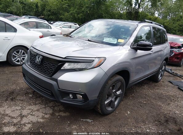 5FNYF8H90MB016936 2021 HONDA PASSPORT Silver Vista tres cuartos delantera izquierda