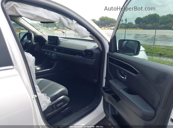 5FNYG2H47PB010859 2023 HONDA PILOT Белый Вид салона спереди