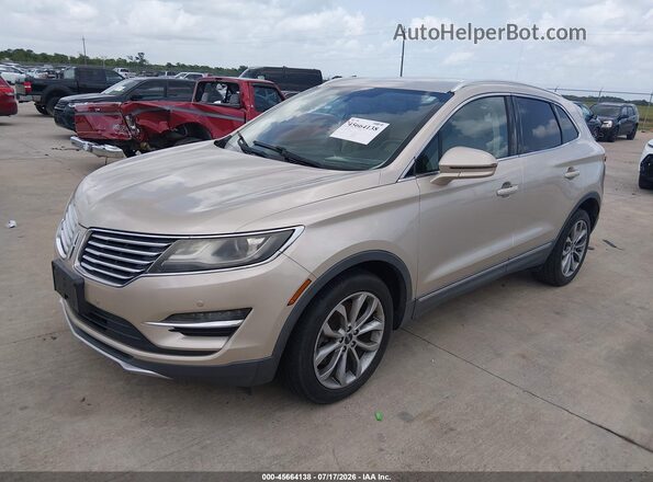 5LMCJ2C90HUL14387 2017 LINCOLN MKC Gold წინა მარცხენა ხედი სამი მეოთხედიდან