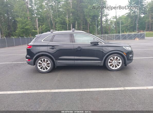 5LMCJ2C99HUL21600 2017 LINCOLN MKC Black Vista interior trasera