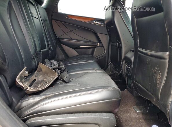 5LMCJ2C99KUL06893 2019 LINCOLN MKC Tan Սալոնի հետևի տեսք