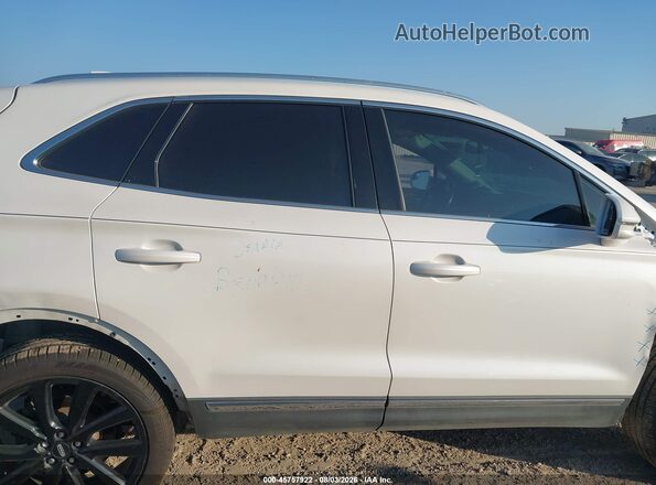 5LMCJ2D90KUL01757 2019 LINCOLN MKC White Vista interior trasera
