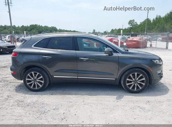5LMCJ3C96KUL16898 2019 LINCOLN MKC Gray Vista interior trasera