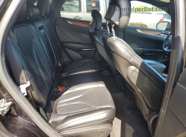 5LMCJ3C99KUL31458 2019 LINCOLN MKC Black Vista interior trasera