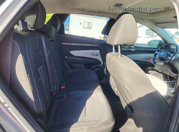 5NMJF3AE7NH048763 2022 HYUNDAI TUCSON Silver Rear interior view