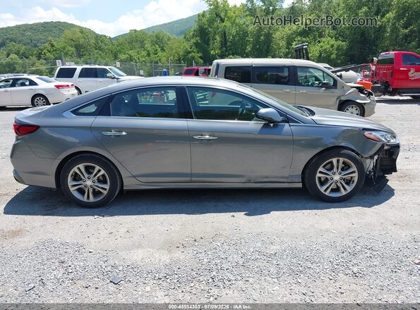 5NPE34AF6KH753268 2019 HYUNDAI SONATA Silver Vista interior trasera