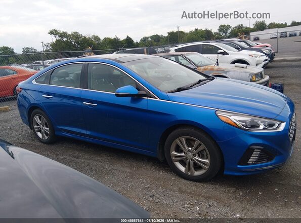 5NPE34AF7KH737127 2019 HYUNDAI SONATA Blue Widok wnętrza z tyłu