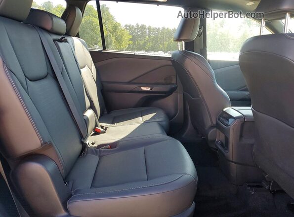 5TDAAAB66SS032931 2025 LEXUS TX White Widok wnętrza z tyłu