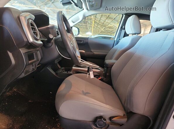 5TFSZ5AN2KX201768 2019 TOYOTA TACOMA White წინა სალონის ხედი