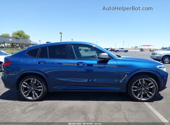 5UX2V5C01L9B52874 2020 BMW X4 Blue Rear interior view