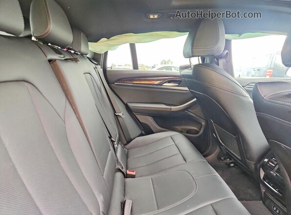 5UX33DT03R9W98912 2024 BMW X4 White Rear interior view