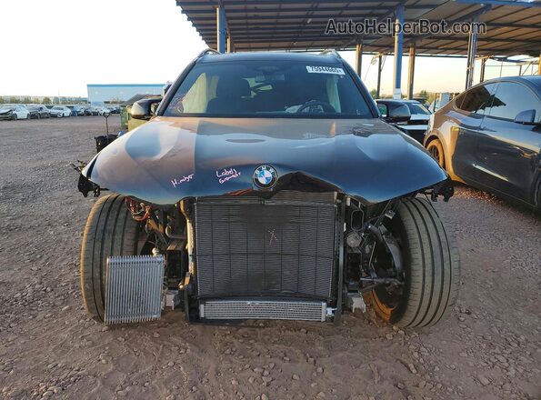 5UX33EM04R9V48943 2024 BMW X7 Синий Вид спереди