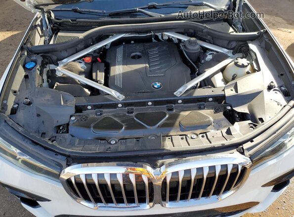 5UXCW2C04L9B00476 2020 BMW X7 White Սալոնի հետևի տեսք