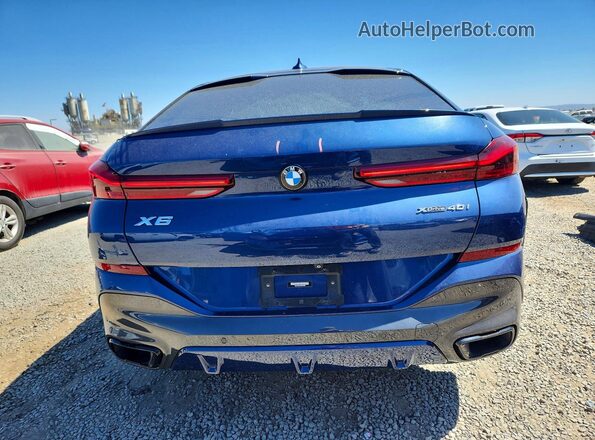 5UXCY6C01N9M19626 2022 BMW X6 Blue Rear view