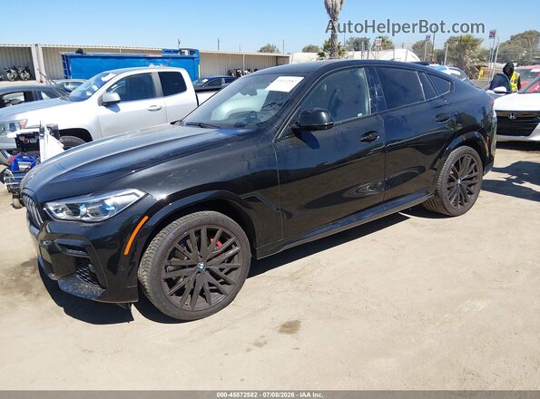5UXCY6C06N9M42450 2022 BMW X6 Black Vista tres cuartos delantera izquierda