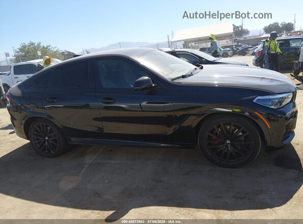 5UXCY6C06N9M42450 2022 BMW X6 Black Vista interior trasera