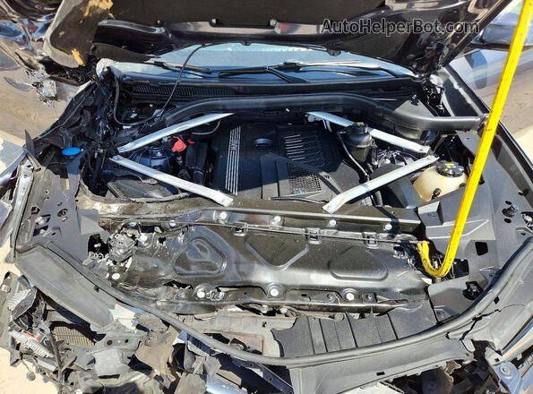 5UXCY6C0XL9D54551 2020 BMW X6 Charcoal Widok wnętrza z tyłu