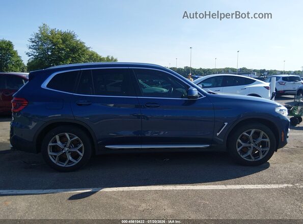 5UXTY5C04M9F21496 2021 BMW X3 Blue Vista interior trasera