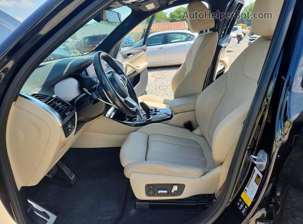5UXTY5C08M9F54503 2021 BMW X3 Black Front interior view