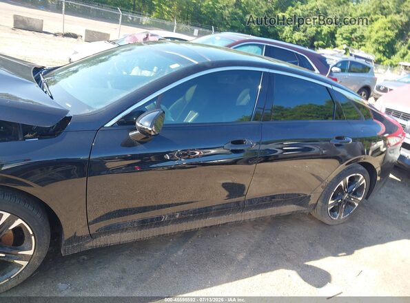 5XXG64J2XRG258221 2024 KIA K5 Black Սալոնի հետևի տեսք