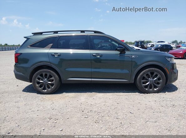 5XYRKDLF4PG196702 2023 KIA SORENTO Green Vista interior trasera