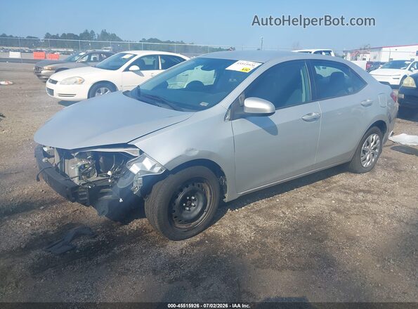 5YFBURHE0KP876903 2019 TOYOTA COROLLA Silver Vista tres cuartos delantera izquierda