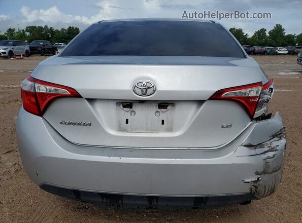 5YFBURHE4GP501863 2016 TOYOTA COROLLA Silver Vista trasera