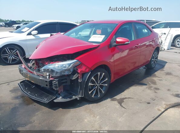 5YFBURHE4HP580663 2017 TOYOTA COROLLA Maroon Vista tres cuartos delantera izquierda