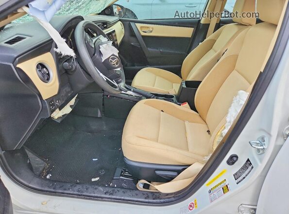 5YFBURHE4HP596474 2017 TOYOTA COROLLA White წინა სალონის ხედი