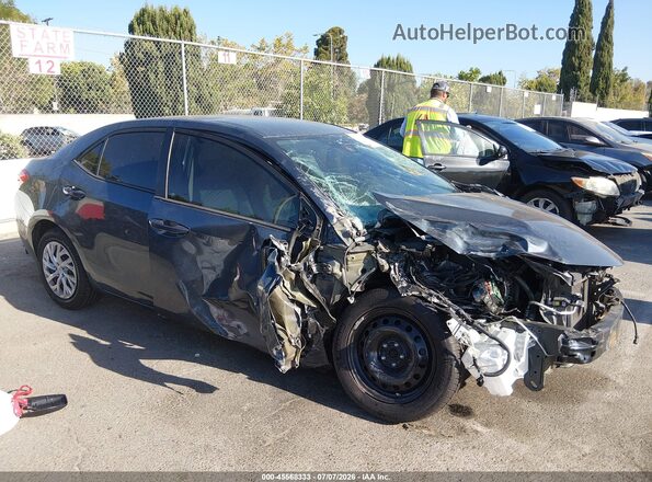 5YFBURHE4HP644734 2017 TOYOTA COROLLA Gray Widok wnętrza z tyłu