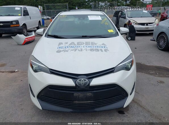 5YFBURHE4HP660562 2017 TOYOTA COROLLA White Rear interior view