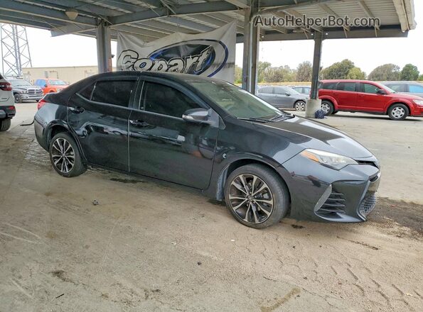 5YFBURHE4HP680956 2017 TOYOTA COROLLA Black Przód prawy