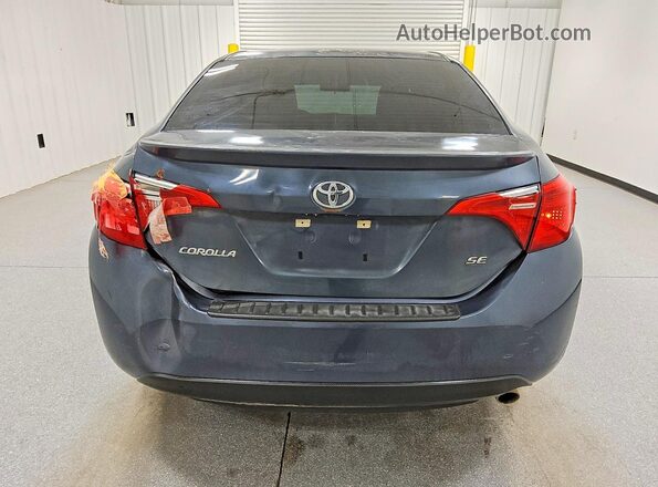 5YFBURHE4HP725989 2017 TOYOTA COROLLA Gray Вид ззаду