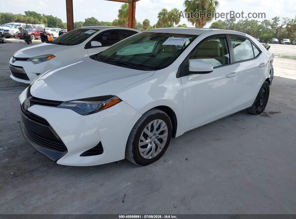 5YFBURHE4KP871638 2019 TOYOTA COROLLA White წინა მარცხენა ხედი სამი მეოთხედიდან