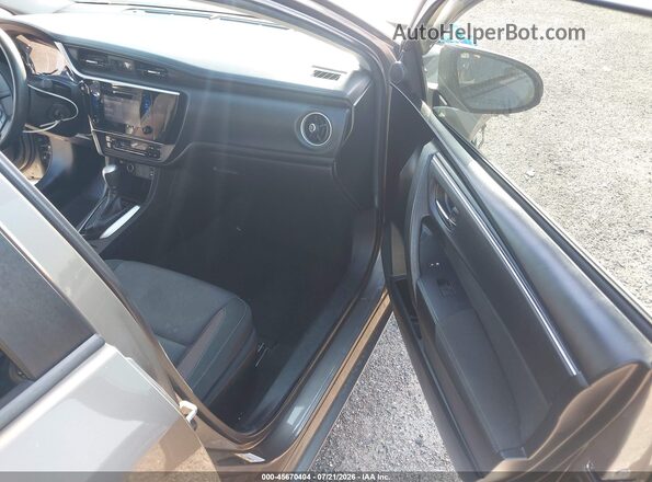 5YFBURHE4KP877696 2019 TOYOTA COROLLA Beige წინა სალონის ხედი