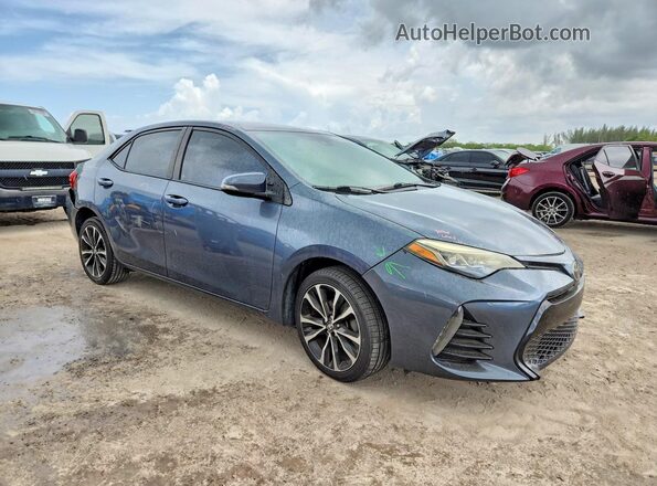 5YFBURHE5HP613007 2017 TOYOTA COROLLA Gray Delantero derecho
