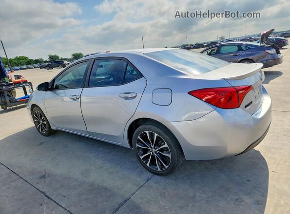 5YFBURHE5KP903285 2019 TOYOTA COROLLA Silver Trasero izquierdo