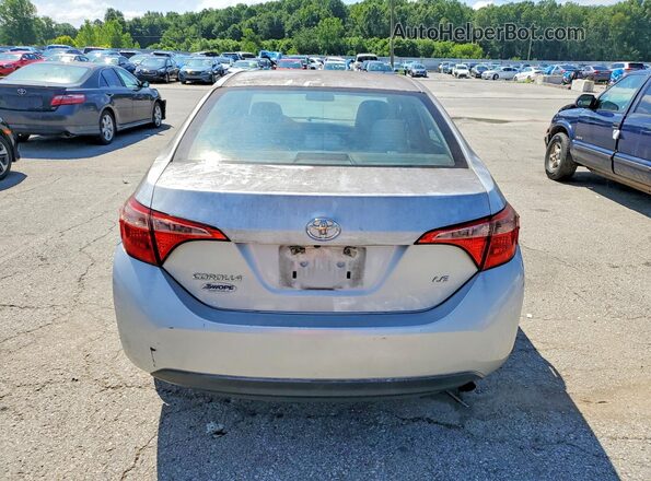 5YFBURHE9KP938654 2019 TOYOTA COROLLA Серебряный Вид сзади