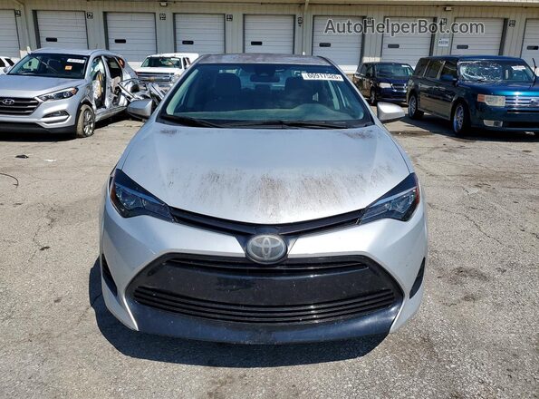 5YFBURHE9KP938654 2019 TOYOTA COROLLA Серебряный Вид спереди