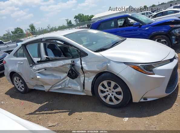 5YFEPMAE6NP327356 2022 TOYOTA COROLLA Silver Vista interior trasera