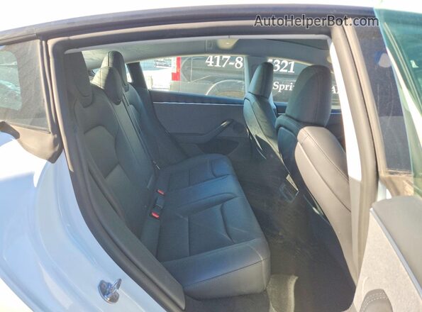 5YJ3E1EA5SF009979 2025 TESLA MODEL White უკანა სავარძლების ხედი