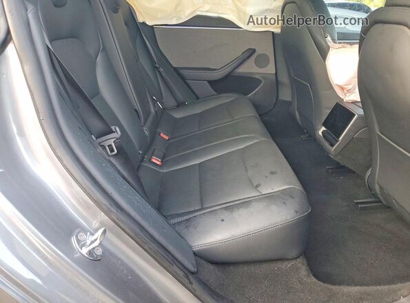 5YJ3E1EA6SF005603 2025 TESLA MODEL Gray Vista interior trasera