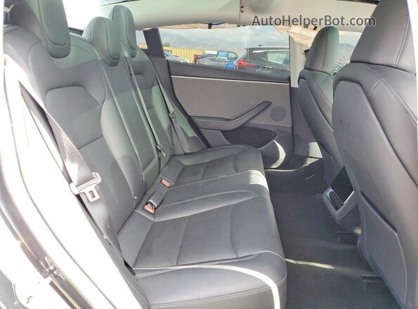 5YJ3E1EA8SF082991 2025 TESLA MODEL Charcoal Widok tylnych siedzeń