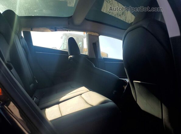 5YJ3E1EA8SF901210 2025 TESLA MODEL Gray უკანა სავარძლების ხედი