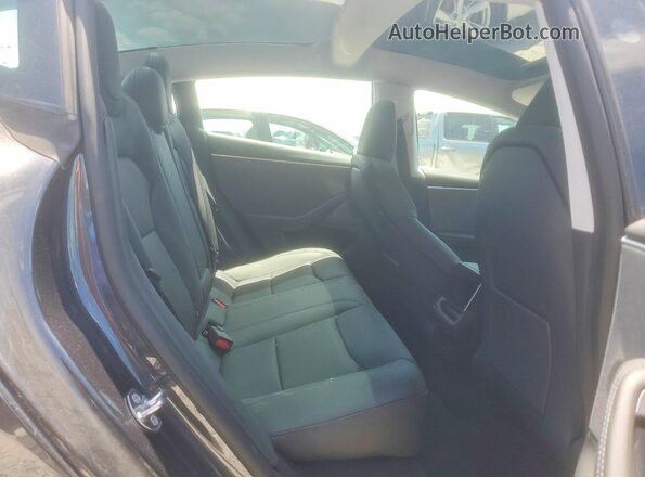 5YJ3E1EA8SF965053 2025 TESLA MODEL Charcoal უკანა სავარძლების ხედი