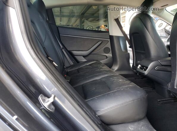 5YJ3E1EB1PF636338 2023 TESLA MODEL Gray Rear seats view