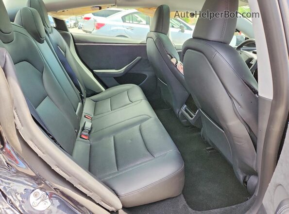 5YJ3E1EB6SF054356 2025 TESLA MODEL Gray Vista de los asientos traseros