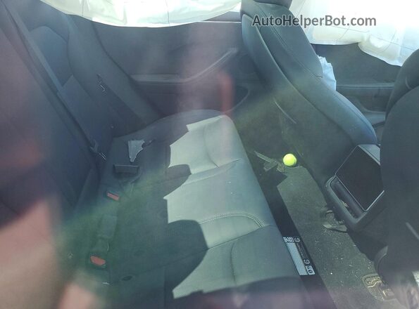 5YJ3E1EB8SF916086 2025 TESLA MODEL Charcoal Vista de los asientos traseros